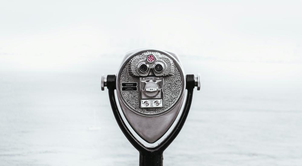 silver viewfinder looking out on water and horizon