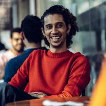 Student sitting at a cafe table