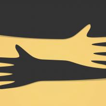 Paper cut outs of different colored hands