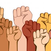 Illustration of different colored fists all raised in the air